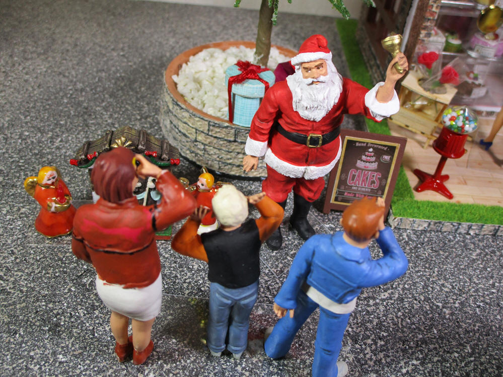 Santa Claus, children and nativity dolls